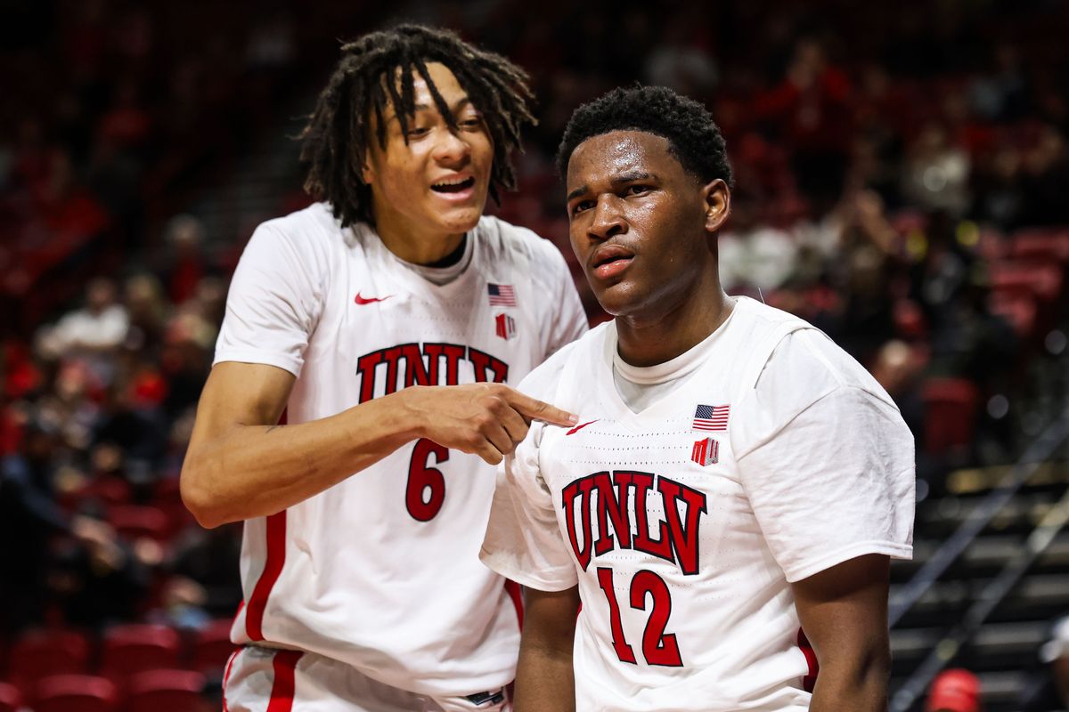 UNLV Runnin' Rebels F Tyrin Jones (6) and UNLV Runnin' Rebels G Isaac Williamson (12) react after Williamson scored against the Saint Joseph's Hawks on Thursday November 20, 2025, in Las Vegas, Nevada. 
