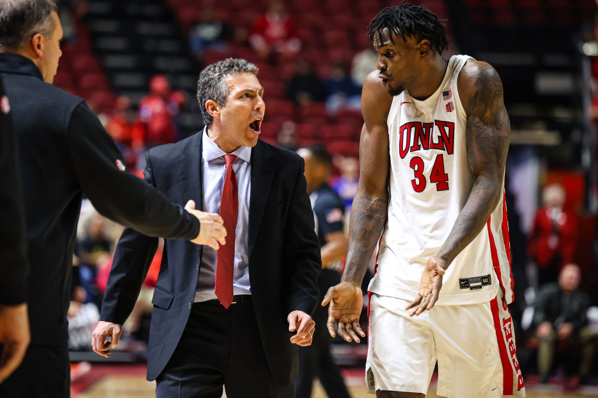 UNLV Runnin' Rebels Head Coach Josh Pastner and UNLV Runnin' Rebels C Emmanuel Stephen (34) converse after Stephen committed a technical foul during a college basketball game against the Boise State Broncos on Tuesday January 13, 2026, in Las Vegas, Nevada. 