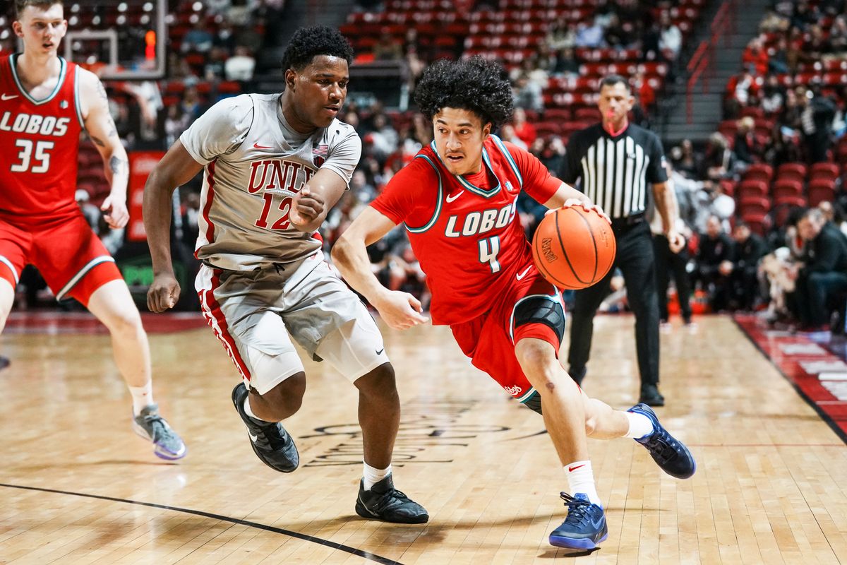 New Mexico guard Uriah Tenette (4) takes the ball down the court while guarded by UNLV Issac Williamson (12)  during second half of college basketball game against UNLV  on Tuesday, January 27, 2026 at Thomas & Mack Arena in Las Vegas.