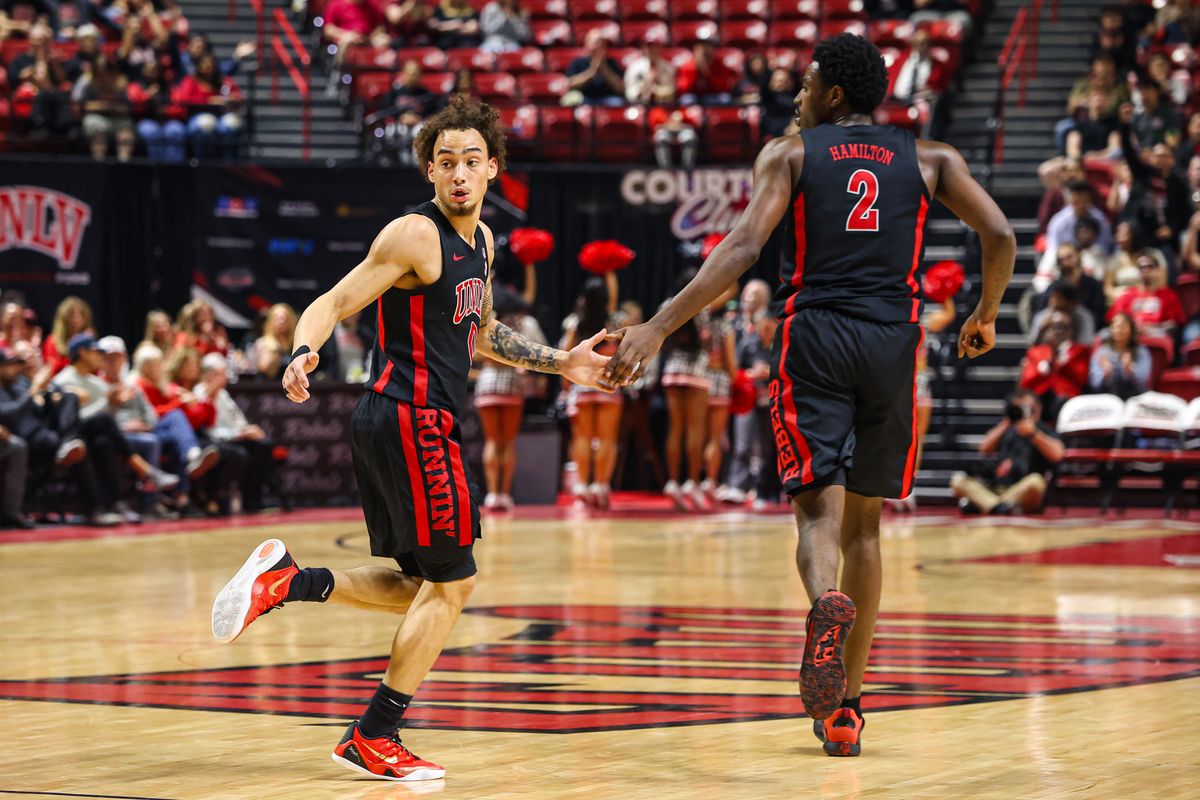 UNLV Runnin' Rebels G Dravyn Gibbs-Lawhorn (0) and teammate F Kimani Hamilton (2) high five after a basket was scored against the Grand Canyon Antelopes on Saturday February 7, 2026, in Las Vegas, Nevada. 
