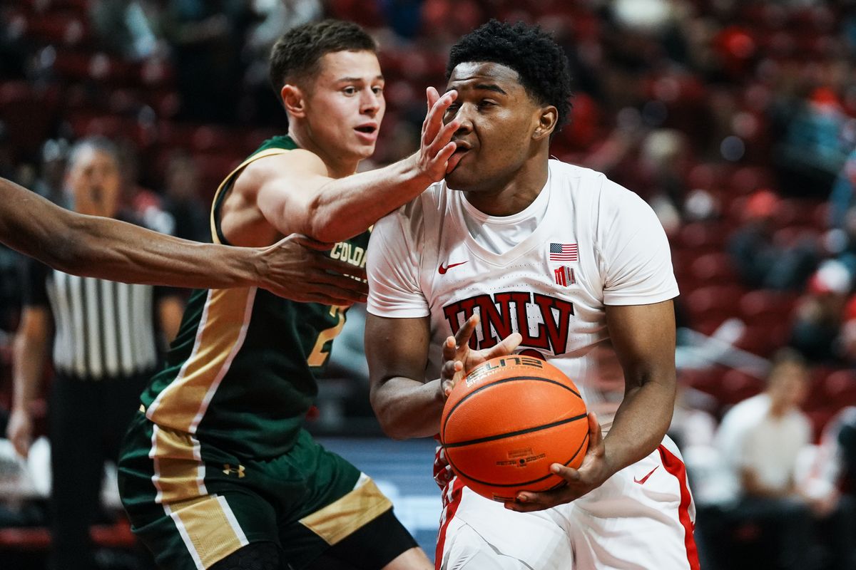 UNLV guard Issac Williamson (12) attempts to move through Colorado State Brandon Rechsteiner (2) during first half of college basketball game against Colorado State on Wednesday, Feb. 18, 2026 at Thomas & Mack Center in Las Vegas. UNLV guard Issac Williamson (12) attempts to move through Colorado State Brandon Rechsteiner (2) during first half of college basketball game against Colorado State on Wednesday, Feb. 18, 2026 at Thomas & Mack Center in Las Vegas.
