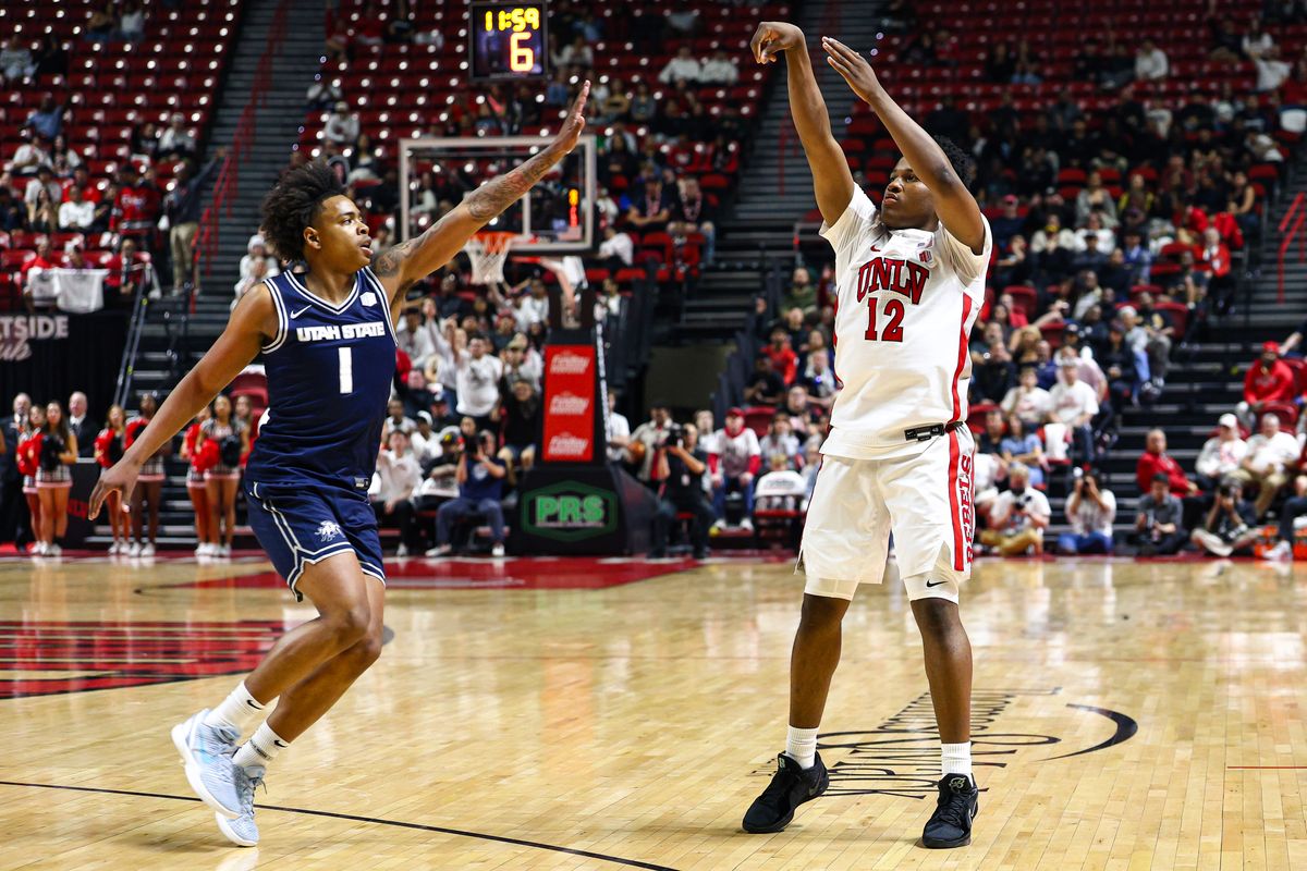 UNLV Runnin' Rebels G Issac Williamson (12) follows through on a three-point shot against the Utah State Aggies on Tuesday March 3, 2026, in Las Vegas, Nevada. 