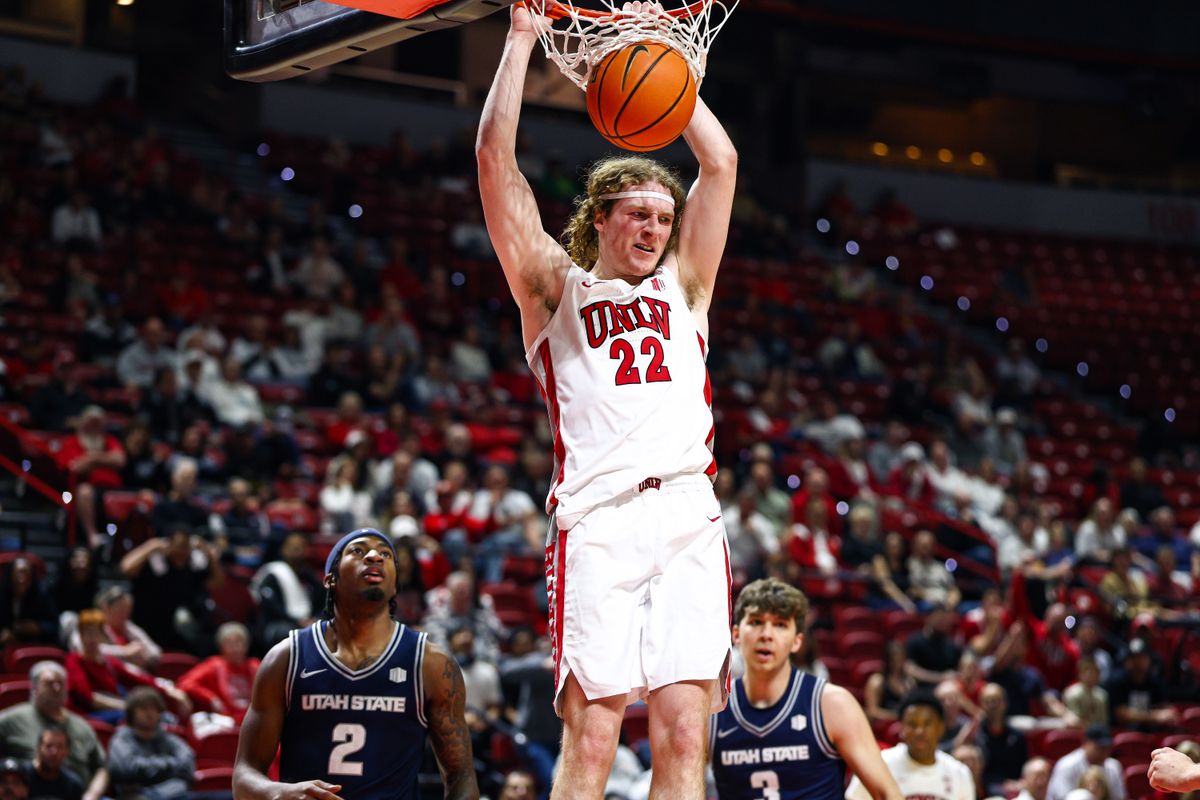 UNLV Runnin' Rebels senior F Walter Brown (22) dunks the ball during a college basketball game against the Utah State Aggies on Tuesday March 3, 2026, in Las Vegas, Nevada. 