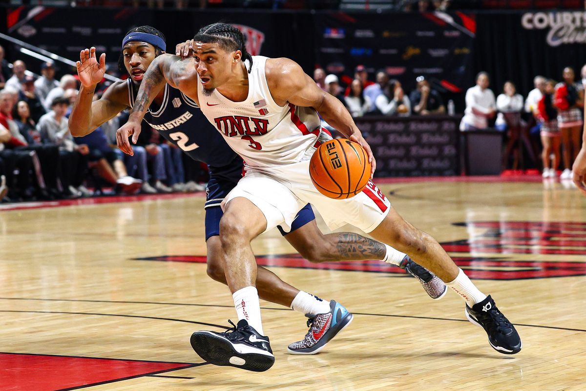  UNLV Runnin' Rebels senior G Howie Fleming Jr. (3) battles for position against a Utah State Aggies player on Tuesday March 3, 2026, in Las Vegas, Nevada. 