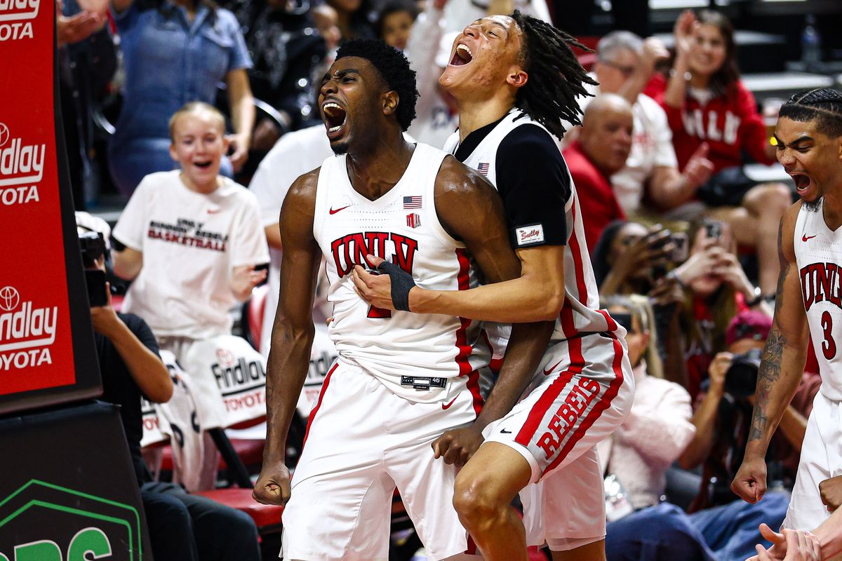 UNLV Runnin' Rebels senior F Kimani Hamilton and teammate F Tyrin Jones (6) celebrate after Hamilton earns a free throw shot after scoring a basket against the Utah State Aggies on Tuesday March 3, 2026, in Las Vegas, Nevada. 