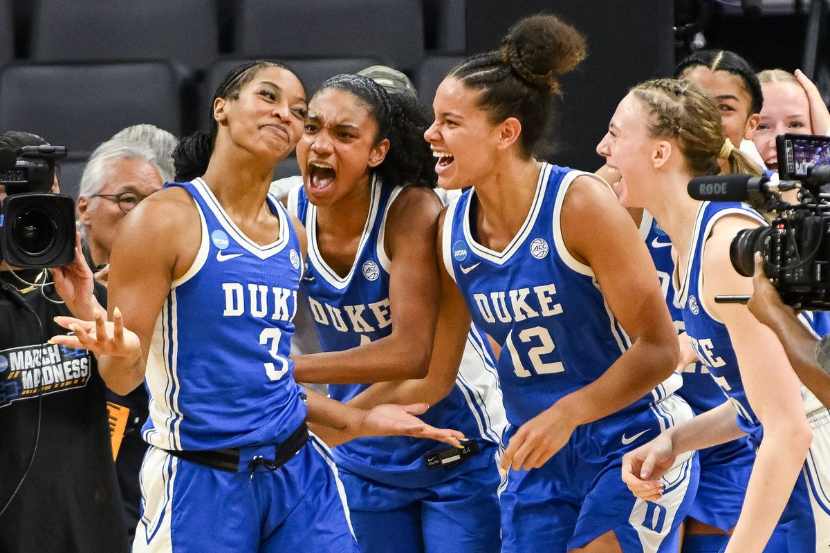 Duke Blue Devils guard Ashlon Jackson (3) celebrates with forward Delaney Thomas (12) and forward Toby Fournier (35) after making a game-winning shot against the Louisiana State Tigers during a Sweet Sixteen game of the Sacramento Regional 2 of the women's 2026 NCAA Tournament at Golden 1 Center. 