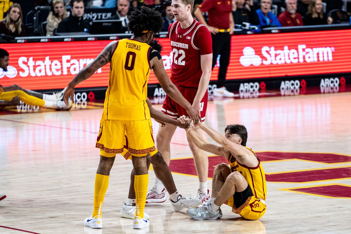 USC Trojans G Clark Slajchert (32) gets helped up after making an and one three pointer in the game against Wisconsin on Saturday, January 18th, 2025, at Galen Center in Los Angeles, CA.