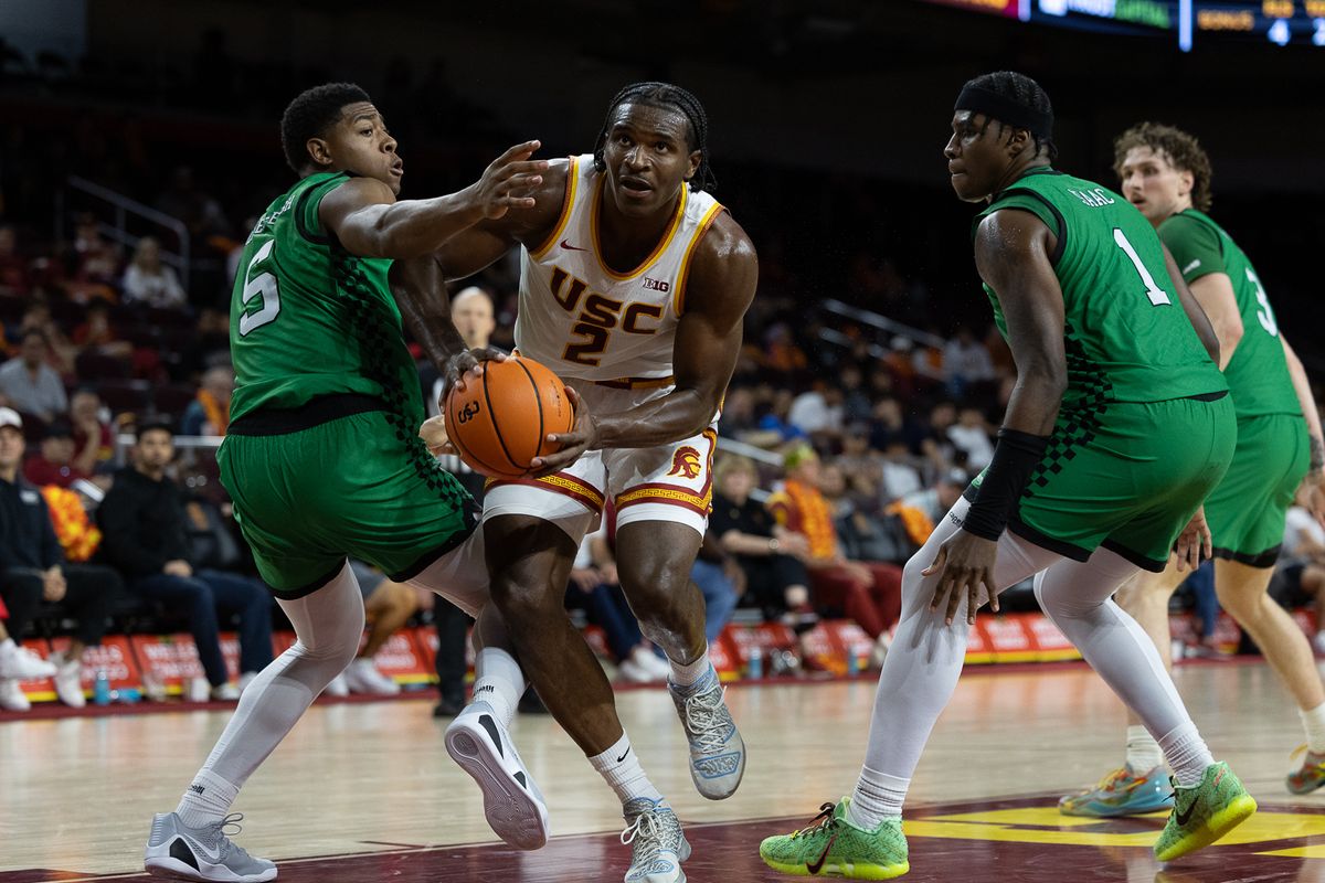 USC Forward Ezra Ausar (2) drives to the basket during a Big Ten basketball game against Manhattan, Sunday November 9, 2025 in Los Angeles, Calif. USC Forward Ezra Ausar (2) drives to the basket during a Big Ten basketball game against Manhattan, Sunday November 9, 2025 in Los Angeles, Calif.