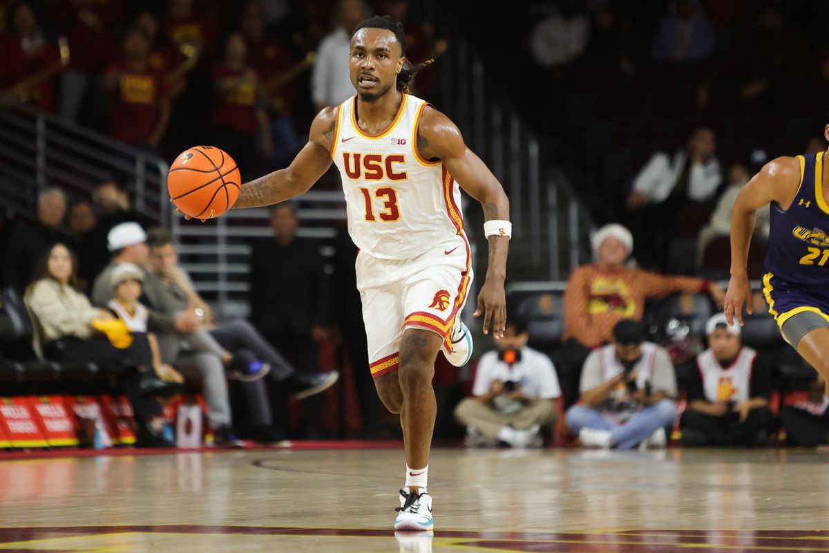 #13 G Kam Woods of USC dribbles the ball up the floor during a NCAA basketball against UC Santa Cruz on December 21, 2025 in Los Angeles, CA.