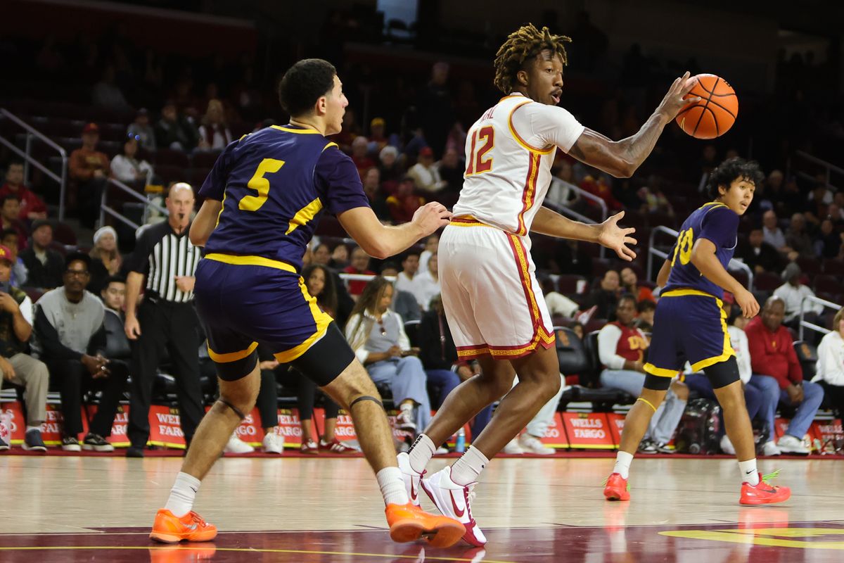 #12 G EJ Neal Jr. of USC attempts a pass during a NCAA basketball against UC Santa Cruz on December 21, 2025 in Los Angeles, CA.