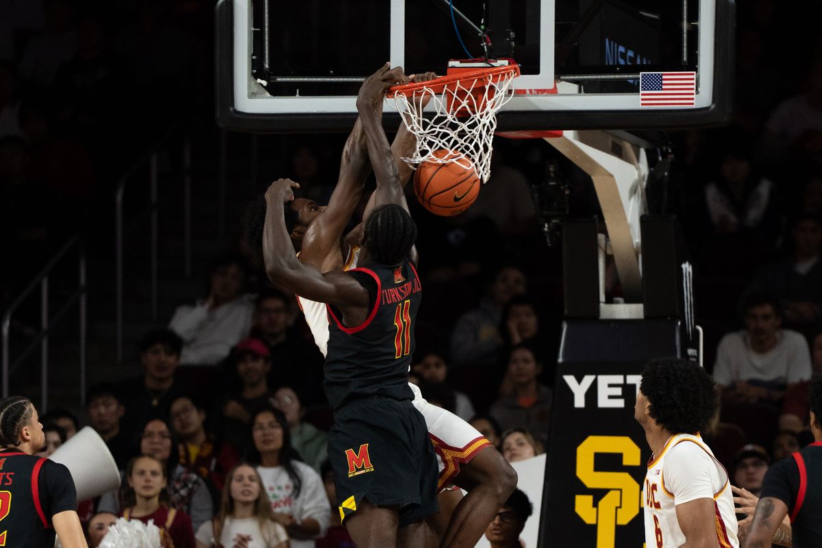 USC Trojans Forward Ezra Ausar (2) has a put back dunk on the defender during a men's college basketball game against the Maryland Terrapins, Tuesday January 13th, 2026 at Galen Center in Los Angeles, Calif.