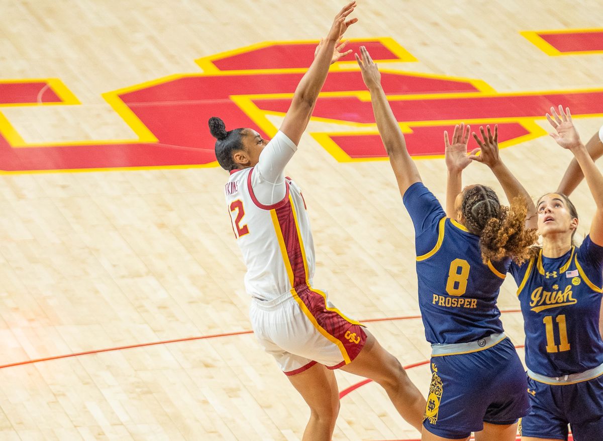 USC guard Juju Watkins (12) shoots a shot over two defenders in a game against Notre Dame, Saturday November 23, 2024 in Los Angeles, Calif.