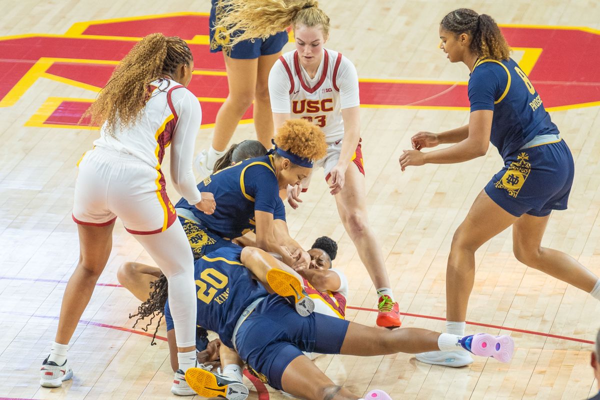 Notre Dame players fight for the ball on the ground in a game against USC, Saturday November 23, 2024 in Los Angeles, Calif.