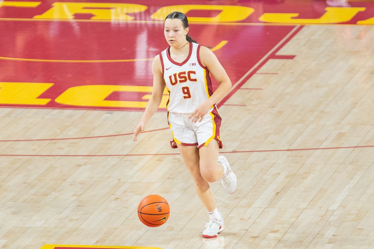 USC guard Kayleigh Heckel (9) dribbles the ball down the court in a game against Notre Dame, Saturday November 23, 2024 in Los Angeles, Calif.