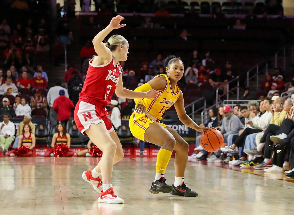 USC G (10) Malia Samuels tries to dribble past a Nebraska Cornhuskers defender on January 1, 2025 at the Galen Center in Los Angeles, CA.