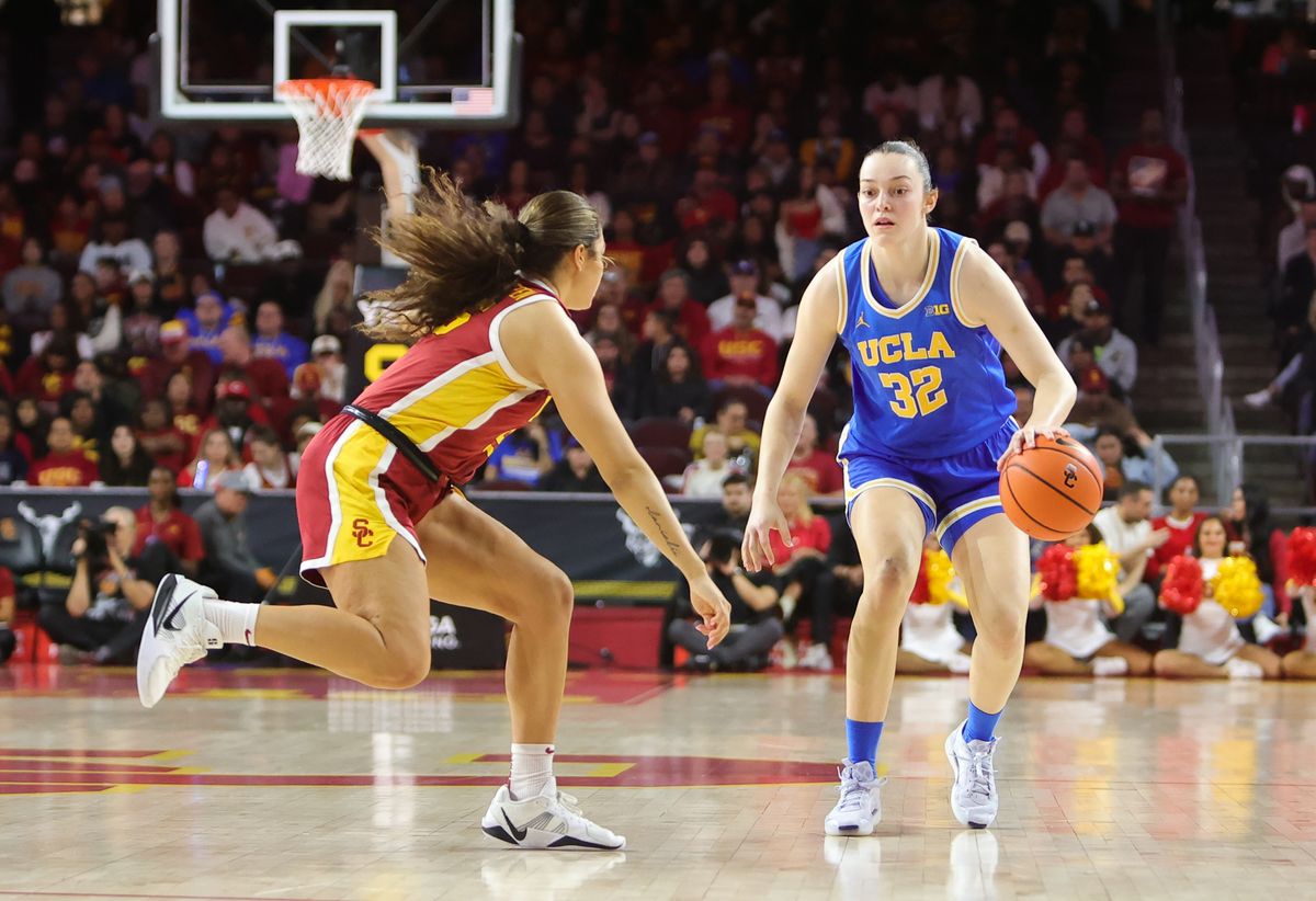 UCLA F (32) Angela Dugalic dribbles against USC on February 13, 2025 at the Galen Center in Los Angeles, CA. UCLA F (32) Angela Dugalic dribbles against USC on February 13, 2025 at the Galen Center in Los Angeles, CA.