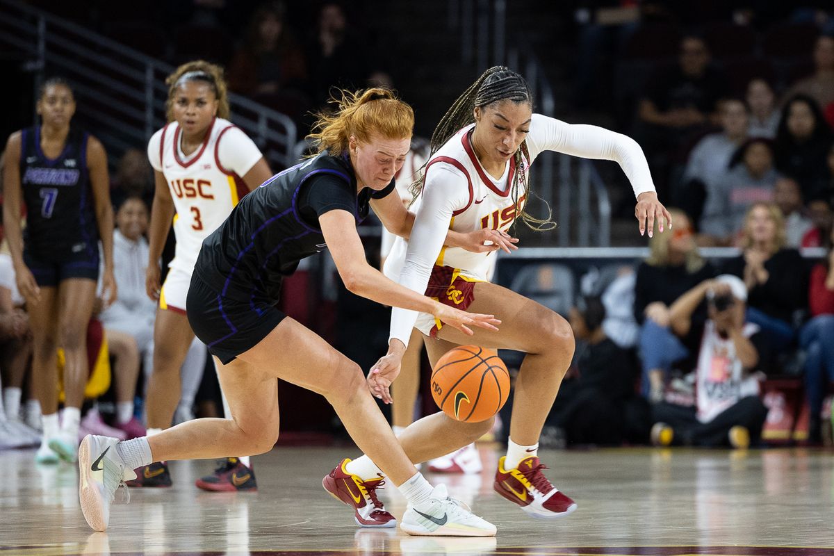 USC guard Kennedy Smith (11) steals the ball during a Big Ten college basketball game against the Portland Pilots, Tuesday November 18, 2025 in Los Angeles.