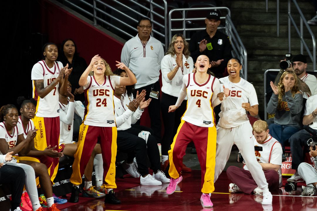 USC bench celebrates a made shot during a Big 10 basketball game against the University of Connecticut, Saturday, December 13th, 2025 in Los Angeles, California