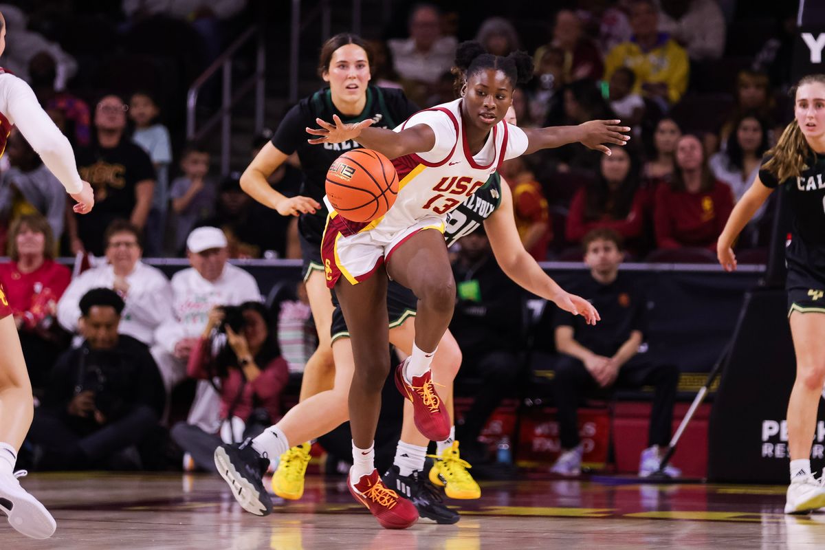 USC Trojans guard Dayana Mendes (13) reaches for the ball during the women's college basketball game against the Cal Poly Mustangs, Thursday December 18th, 2025 at Galen Center in Los Angeles, Calif.