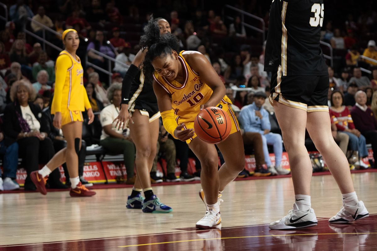 USC Trojans Guard Malia Samuels (10) gets hit while attacking the rim during a women's college basketball game against the Purdue Boilermakers, Sunday January 18th, 2026 at Galen Center in Los Angeles, Calif.