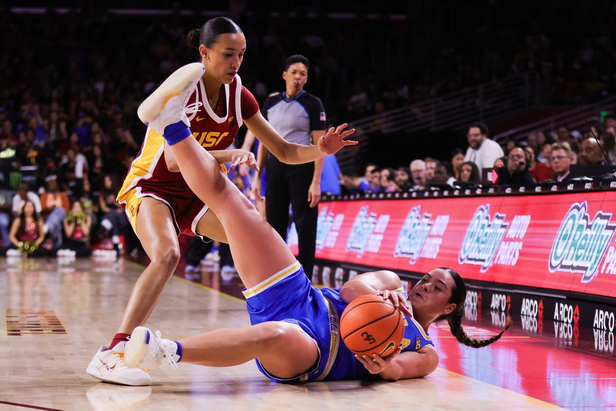 USC Trojans guard Charlisse Leger-Walker (5) falls with the ball during the women's college basketball game against the UCLA Bruins, Sunday March 1st, 2026 at Galen Center in Los Angeles, Calif.