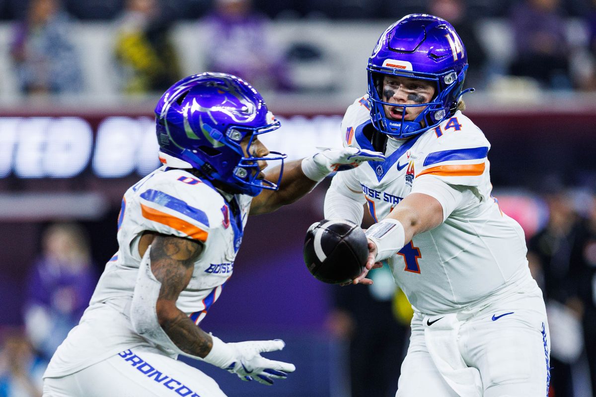 Boise State Broncos quarterback Maddux Madsen (4) hands the ball to running back Malik Sherrod (8) during the LA Bowl against the Washington Huskies on December 13, 2025 in Los Angeles, California.