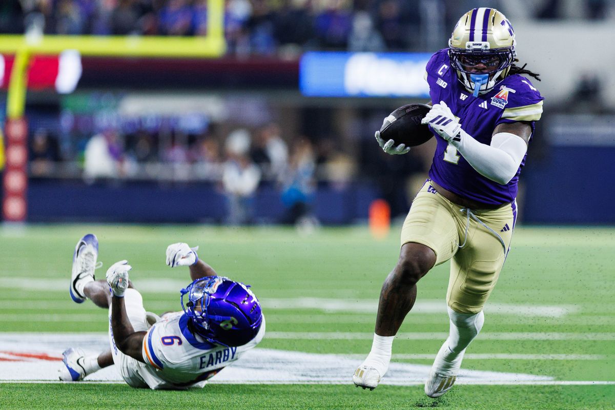 Washington Huskies running back Jonah Coleman (1) runs with the ball signals first down during the LA Bowl against the Boise State Broncos on December 13, 2025 in Los Angeles, California.