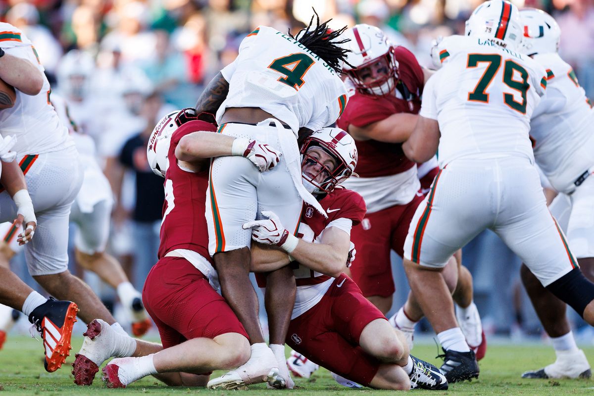 Mark Fletcher Jr. #4 of the Miami Hurricanes is tackled during the game against Stanford Cardinal at Stanford Stadium on September 4, 2026 in Stanford, California. 