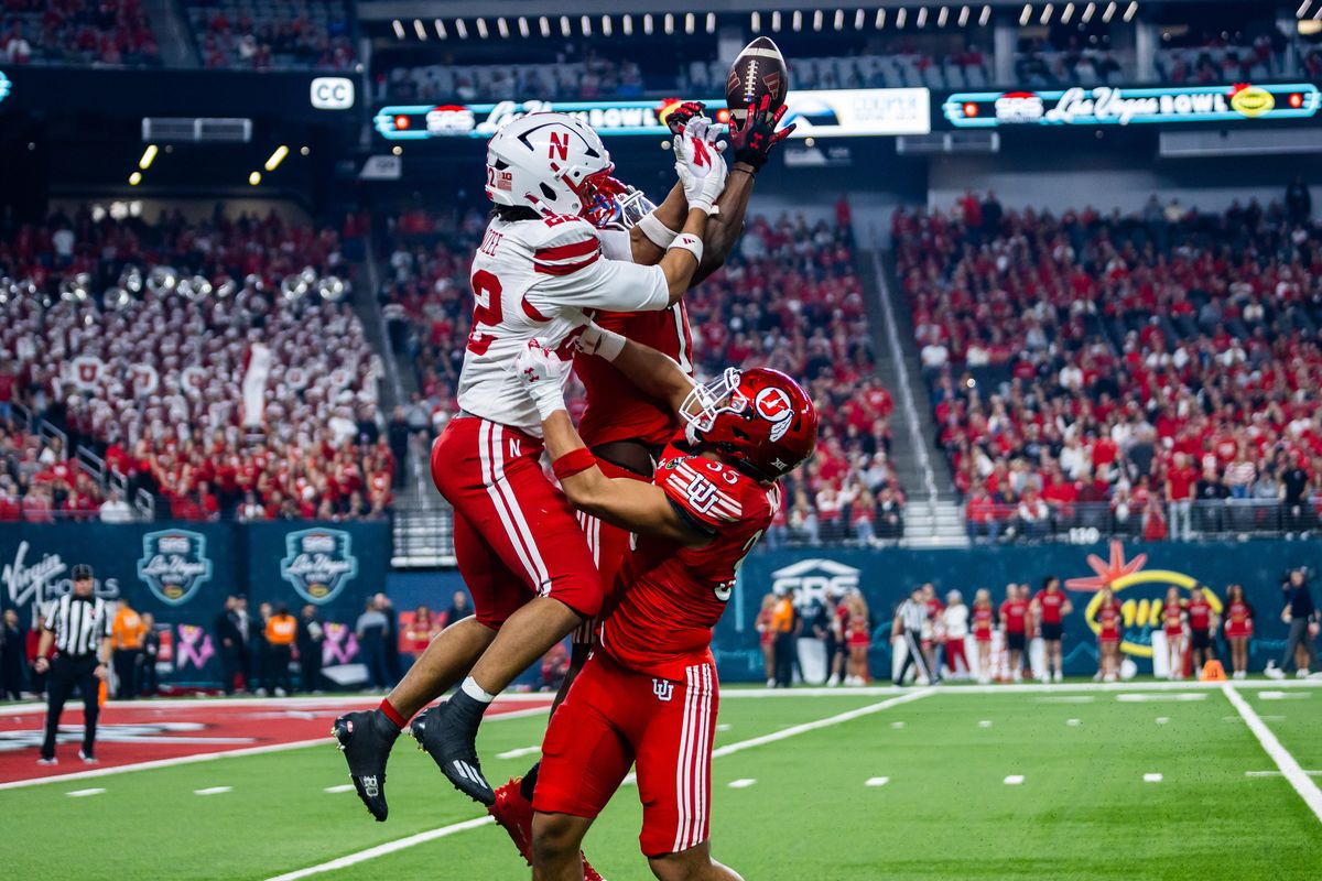Nebraska Huskers running back Isiah Mozzee (22) jumps for a pass with Utah Utes defenders during the SRS Distribution Las Vegas Bowl game between the Nebraska Huskers and the Utah Utes, Sunday December 31, 2025 in Las Vegas, Nev.