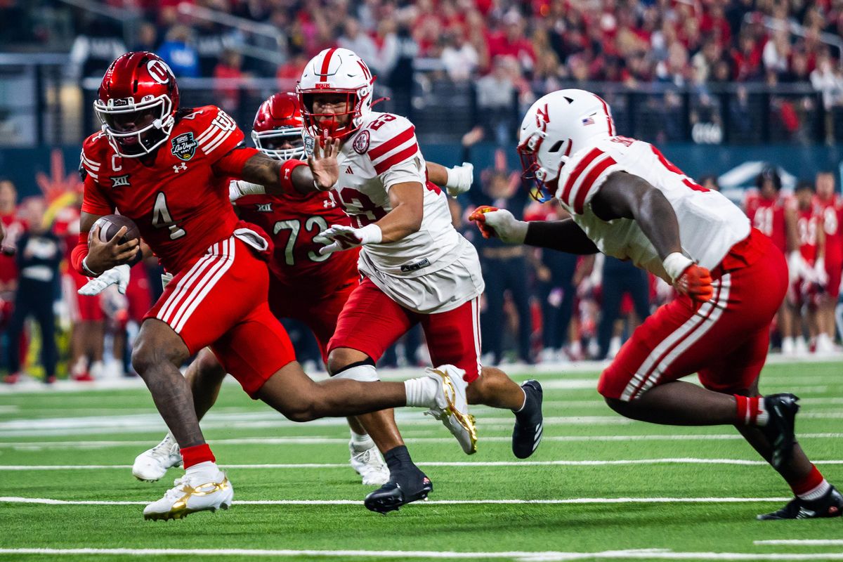 Utah Utes quarterback Devon Dampier (4) runs with the ball and looks to stiff arm a defender during the SRS Distribution Las Vegas Bowl game between the Nebraska Huskers and the Utah Utes, Sunday December 31, 2025 in Las Vegas, Nev.
