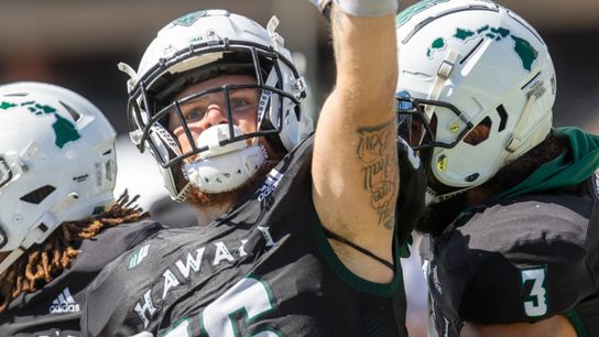 Hawai'i players celebrate on the field during the UCLA-Hawai'i game in Honolulu on Saturday, August 31, 2024.