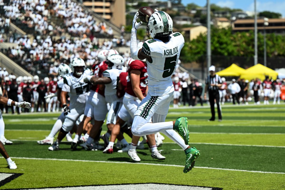 University of Hawai'i Rainbow Warriors wide receiver Pofele Ashlock, #5, catches a touchdown pass during an NCAA football game against the Stanford Cardinal, Saturday, August 23, 2025, in Honolulu, Hawai'i.