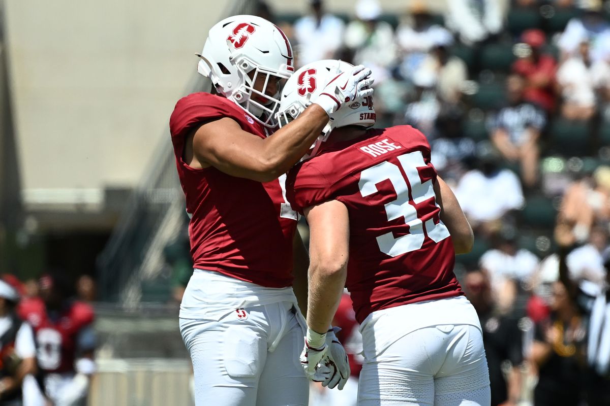Stanford Cardinal outside linebacker Tevarua Tafiti, #11, celebrates inside linebacker Matt Rose's, #35, sack during an NCAA football game against the Hawai'i Rainbow Warriors, Saturday, August 23, 2025, in Honolulu, Hawai'i.