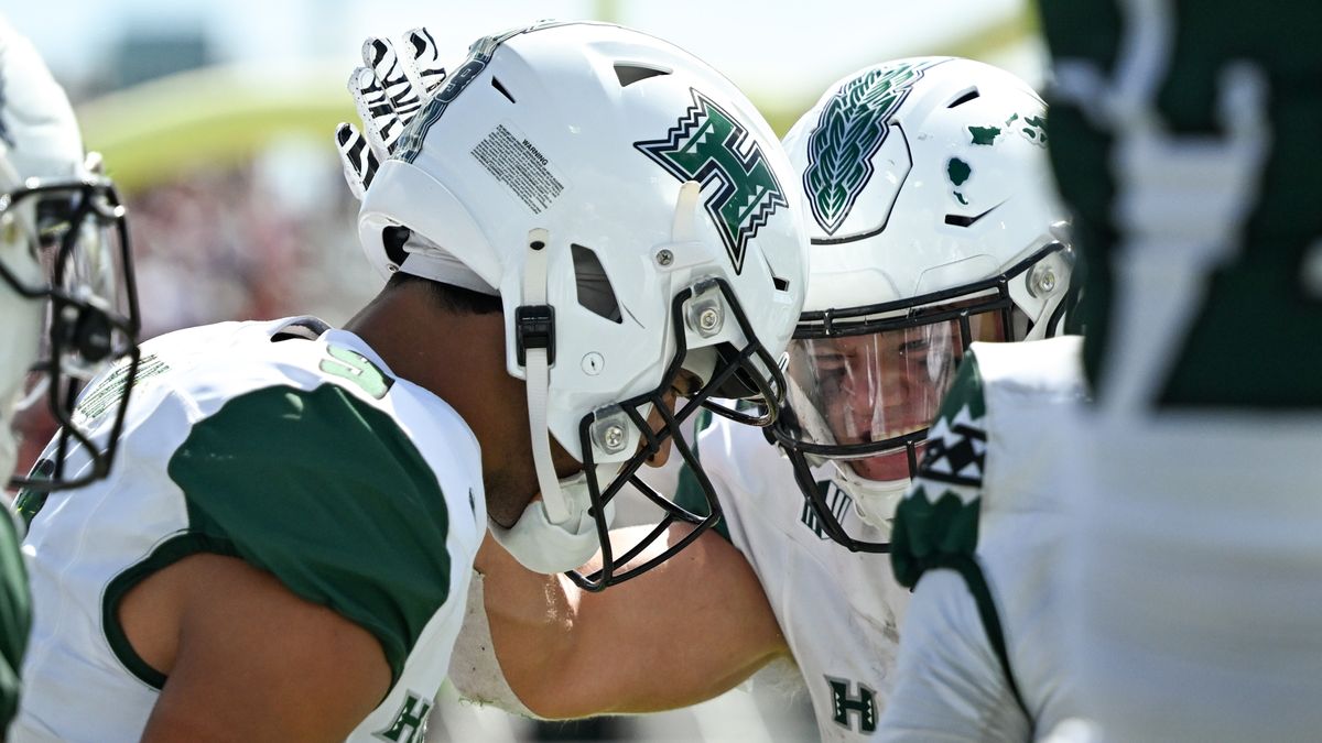 University of Hawai'i Rainbow Warriors running back Landon Sims, #30, celebrates wide receiver Jackson Harris', #9, touchdown during an NCAA football game against the Stanford Cardinal, Saturday, August 23, 2025, in Honolulu, Hawai'i.