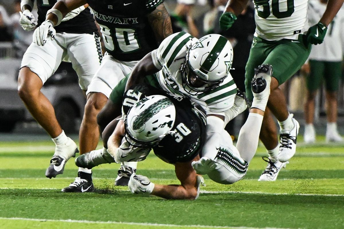Portland State Vikings safety Bryson Ross (7) tackles University of Hawai'i Rainbow Warriors running back Landon Sims (30) during an NCAA football game against the University of Hawai'i Rainbow Warriors, Saturday, September 13, 2025, in Honolulu, Hawai'i.