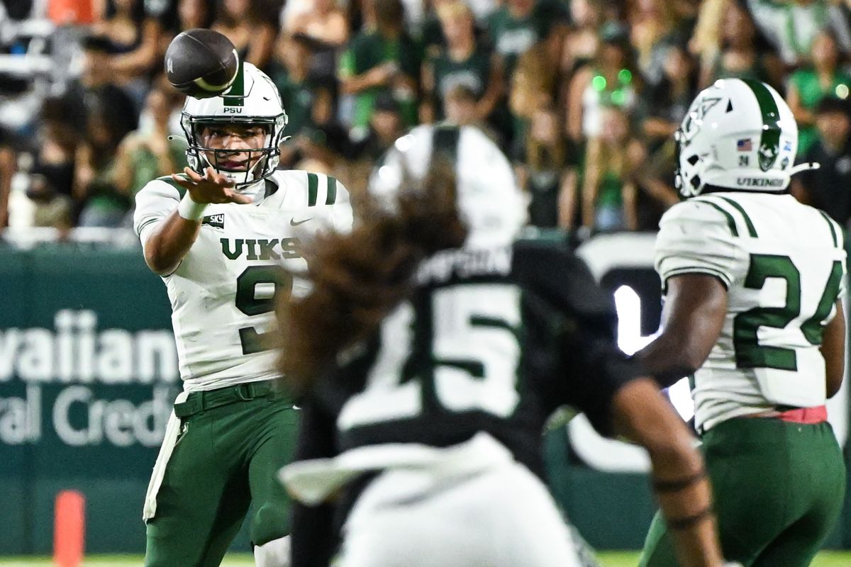 Portland State Vikings quarterback John-Keawe Sagapolutele (9) completes a pass to running back Delon Thompson (24) during an NCAA football game, Saturday, September 13, 2025, in Honolulu, Hawai'i.