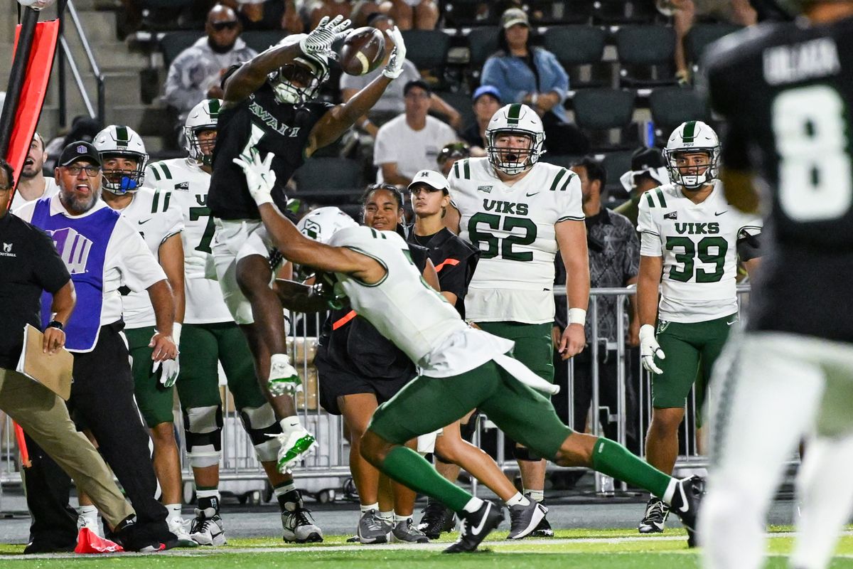 University of Hawai'i Rainbow Warriors wide receiver Brandon White (1) catches a pass while being pushed out of bounds during an NCAA football game, Saturday, September 13, 2025, in Honolulu, Hawai'i.
