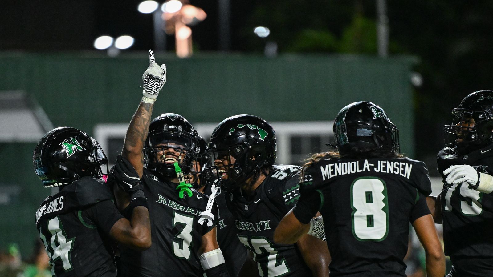 The University of Hawai'i Rainbow Warriors celebrate linebacker Jalen Smith's (3) fumble recovery during an NCAA football game against the Utah State Aggies, Saturday, October 11, 2025.
