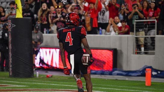 San Diego State's Louis Brown IV reacts after scoring a touchdown on a 44-yard reception against Texas A&M-Commerce.
