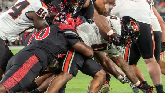 San Diego State defensive linebacker Krishna Clay (40) tackles Oregon State running back Anthony Hankerson (0) during an NCAA football game, Saturday, September 7, 2024 in San Diego, CA.