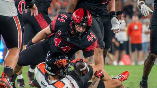 San Diego State linebacker Kyle Moretti (44) tackles Oregon State wide receiver Jeremiah Noga (18) during an NCAA football game, Saturday, September 7, 2024 in San Diego, CA.
