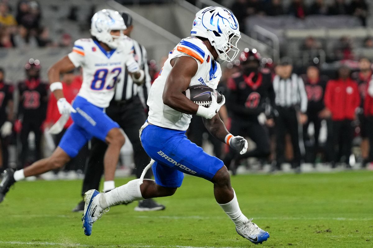 Boise State running back Dylan Riley (24) runs up the field during an NCAA football game against SDSU, Saturday November 15, 2025 in San Diego, California.