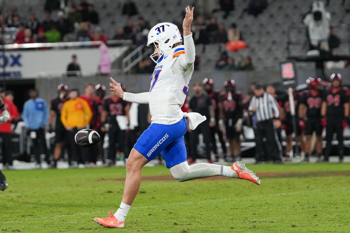 Boise State punter Oscar Doyle (37) punts the ball during an NCAA football game against SDSU, Saturday November 15, 2025 in San Diego, California.