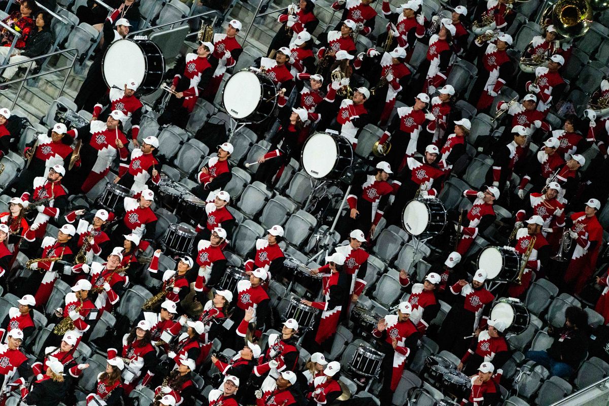 The San Diego State marching band dances in the stands during an NCAA Football game between San Jose State and San Diego State, Saturday November 22, 2025 in San Diego, Calif.