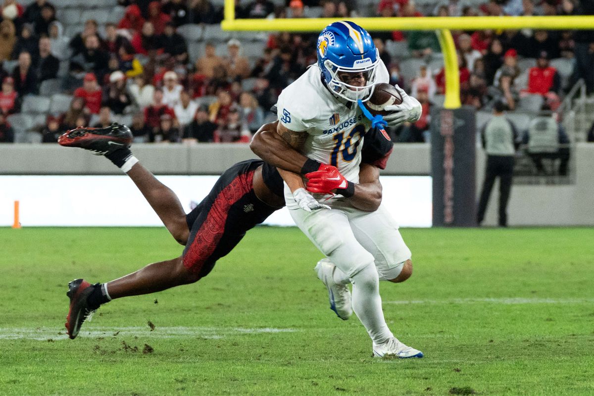 San Diego State safety Eric Butler (6) tackles San Jose State wide receiver Danny Scudero (10) during an NCAA Football game between San Jose State and San Diego State, Saturday November 22, 2025 in San Diego, Calif.