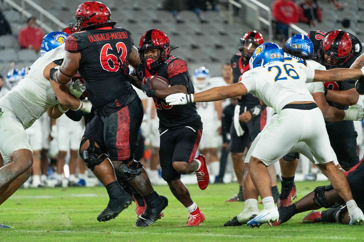 San Diego State running back Christian Washington (23) rushes for a touchdown during an NCAA Football game between San Jose State and San Diego State, Saturday November 22, 2025 in San Diego, Calif.
