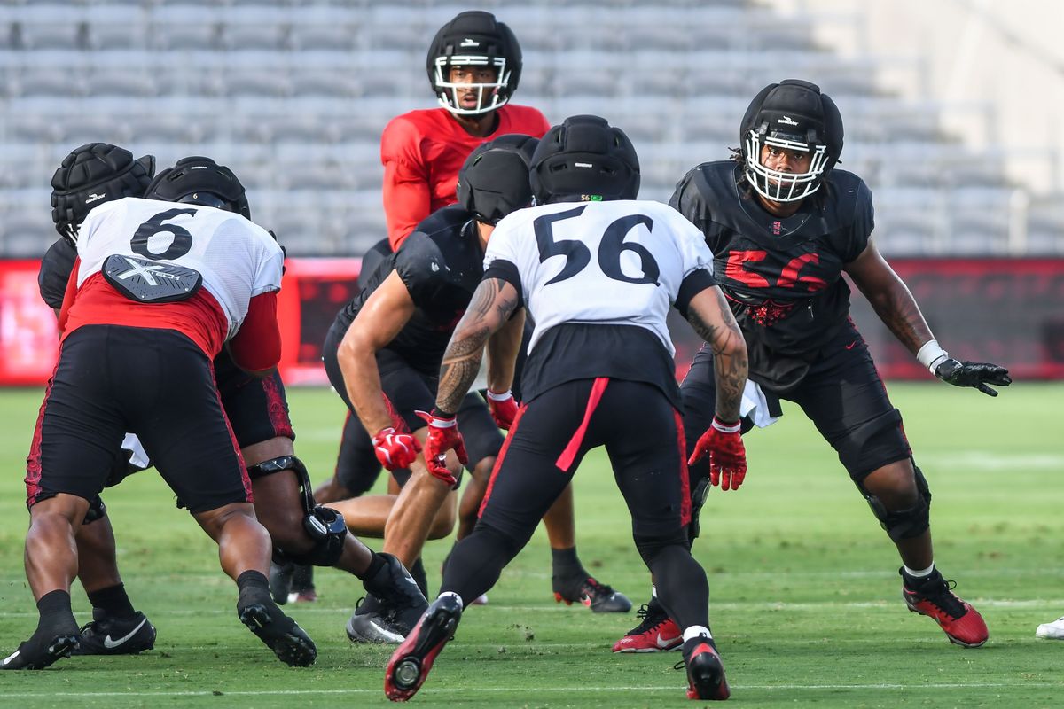 SDSU linebacker Sione Hala (56) SDSU offensive Lineman Isaac Lucas participates in the First scrimmage at Snapdragon Stadium on Saturday August 15, 2026 in San Diego, Calif.. SDSU linebacker Sione Hala (56) SDSU offensive Lineman Isaac Lucas participates in the First scrimmage at Snapdragon Stadium on Saturday August 15, 2026 in San Diego, Calif..