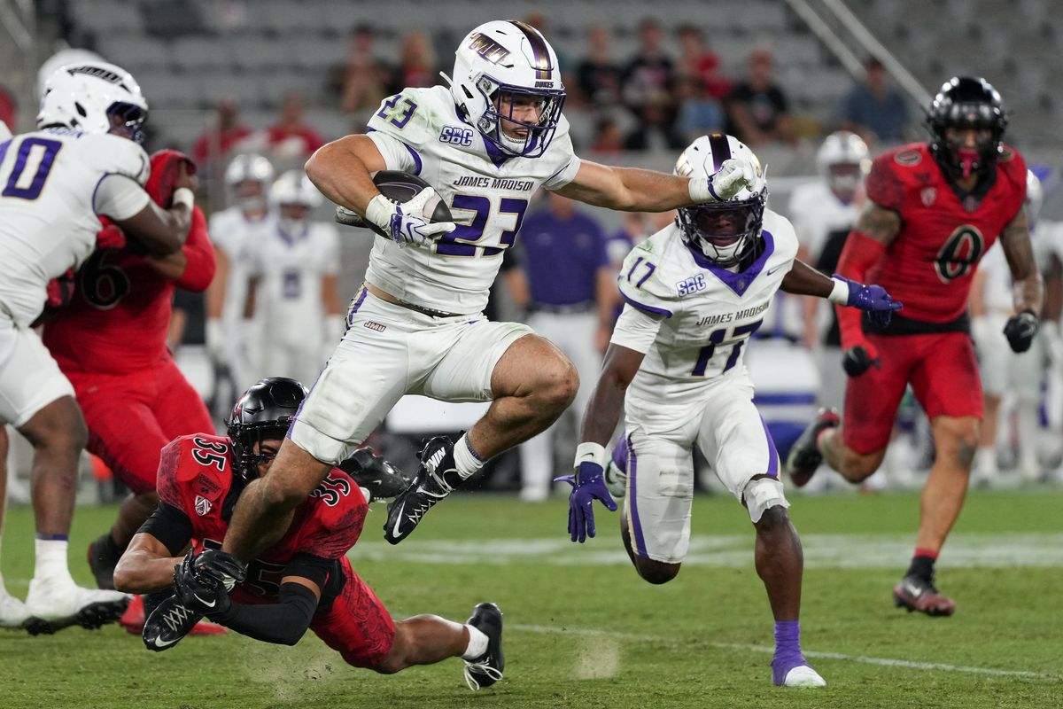 James Madison University running back Nick Herman (23) runs through the defense during an NCAA football game against San Diego State University, Saturday September 19, 2026 in San Diego, California.