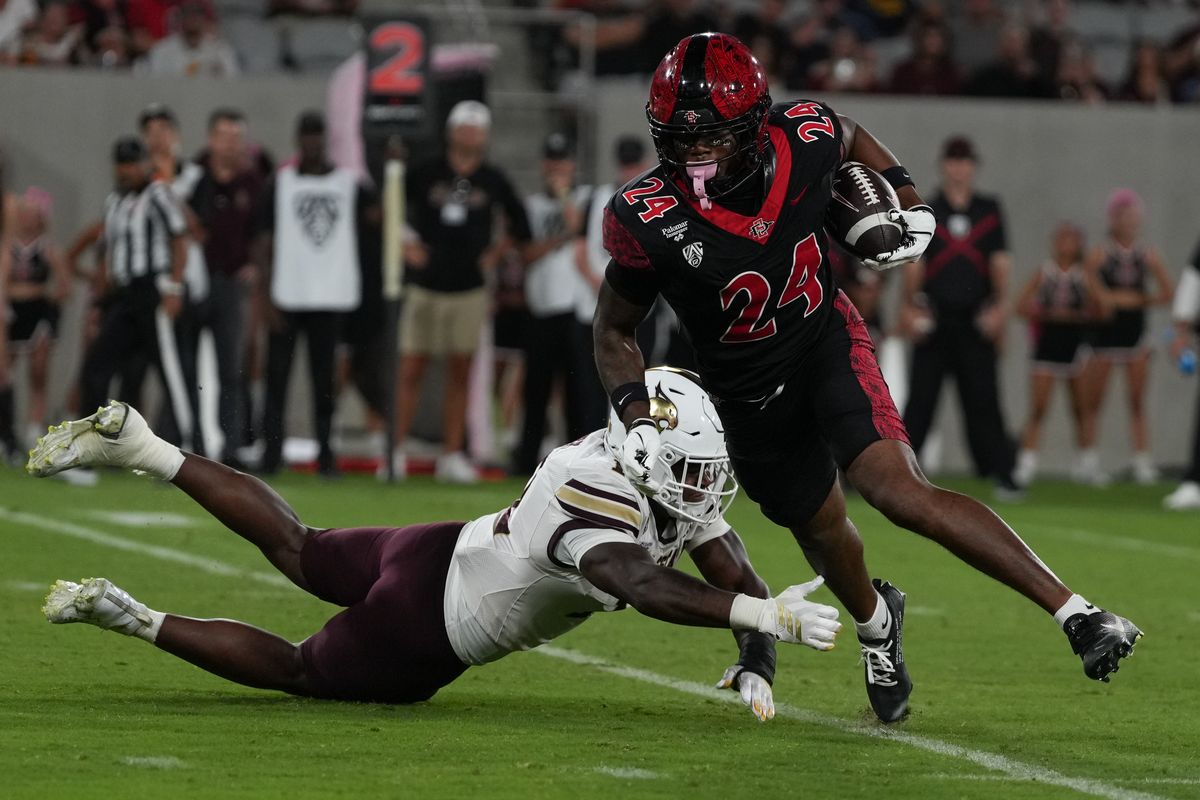 San Diego State University wide receiver Jordan Napier (24) runs through the defense during an NCAA football game against Texas State University, Saturday October 03, 2026 in San Diego, California. San Diego State University wide receiver Jordan Napier (24) runs through the defense during an NCAA football game against Texas State University, Saturday October 03, 2026 in San Diego, California.