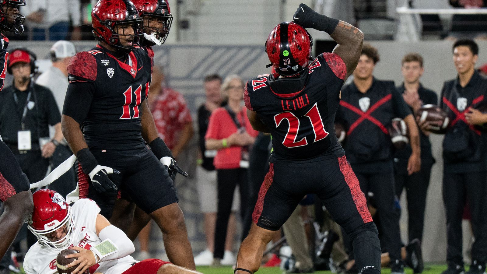 San Diego State University linebacker Tano Letuli (21) celebrates after sacking Fresno State quarterback Jayden Mandal (7) during a PAC-12 football game against Fresno State, Saturday October 17, 2026 in San Diego, California. San Diego State University linebacker Tano Letuli (21) celebrates after sacking Fresno State quarterback Jayden Mandal (7) during a PAC-12 football game against Fresno State, Saturday October 17, 2026 in San Diego, California.